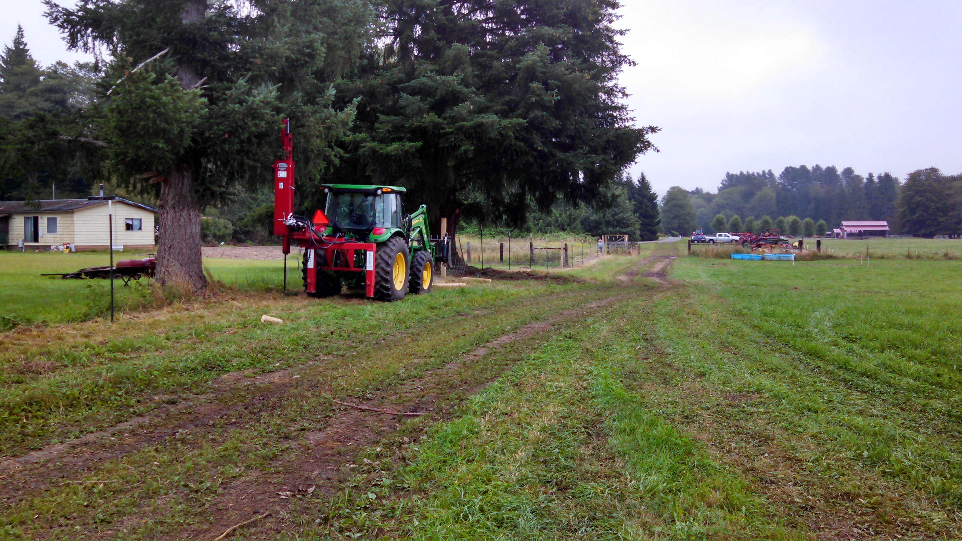 Tulalip Tribes Natural Resources Department news link to Tribes Survey Nooksack Herd Using Elk Scat with image of tractor near trees in field