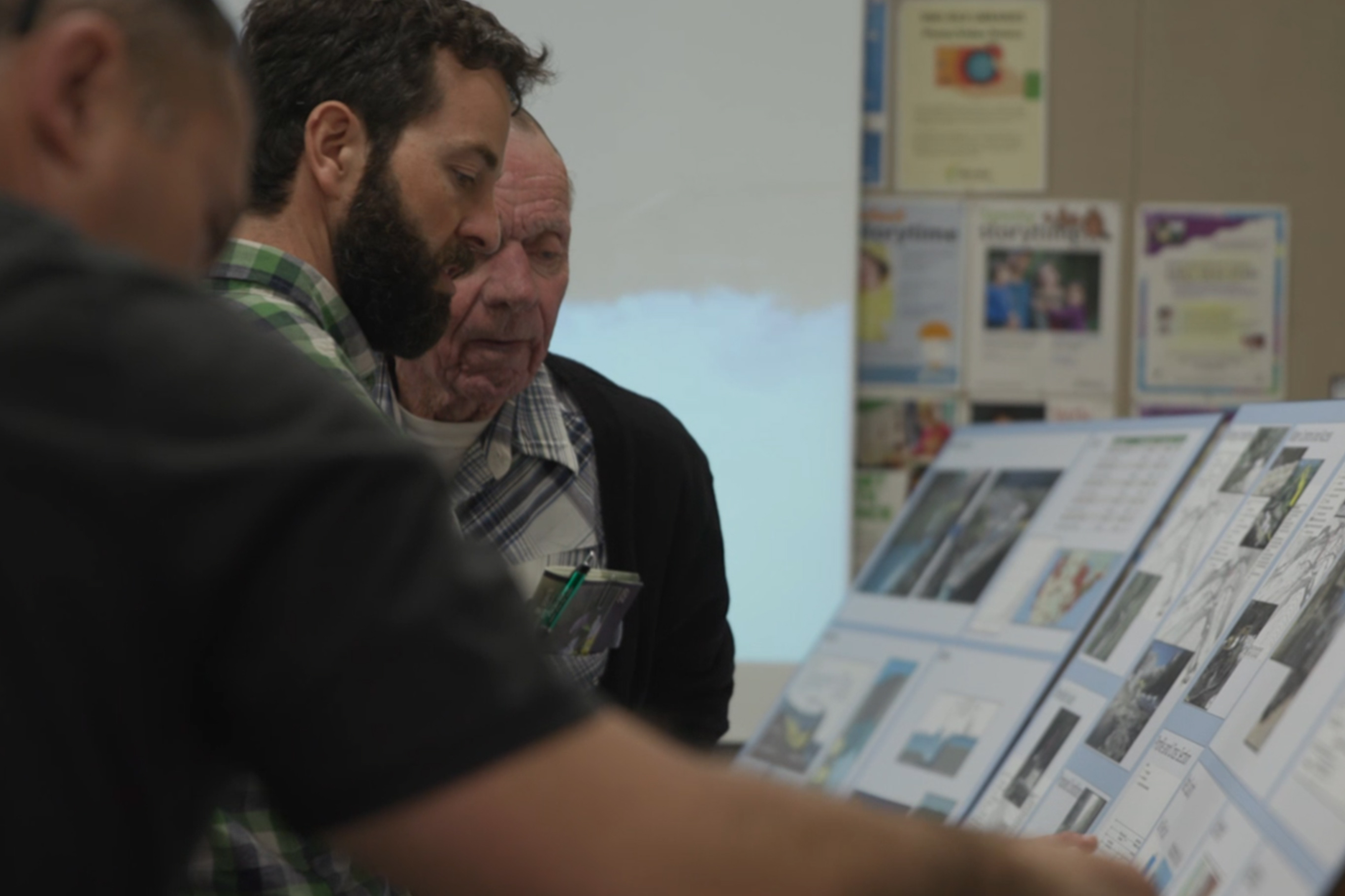 Tulalip Tribes Natural Resources staff looking over Pilchuck River Dam charts slider image